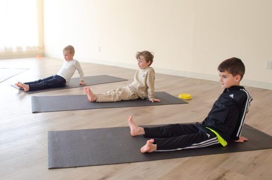 Kosha Kids Club boys doing yoga