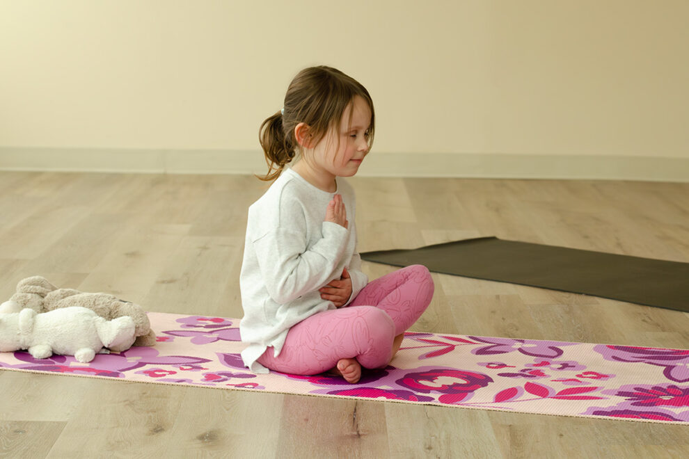 Kosha Kids Club young girl doing yoga